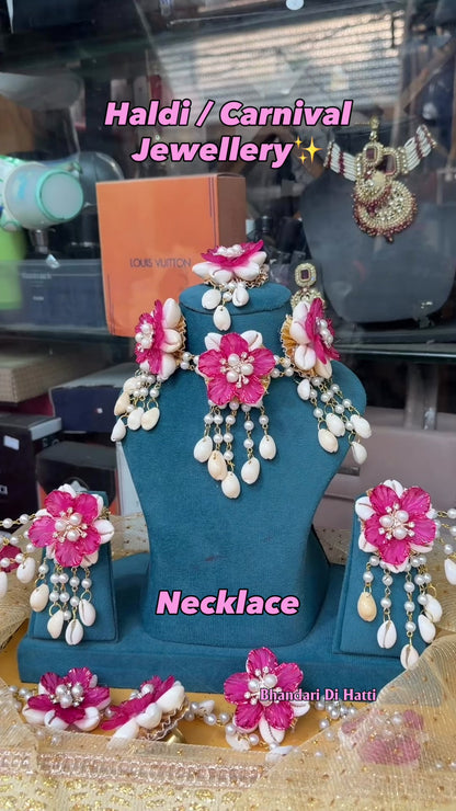 Enchanting Blossoms and Cowrie Dark Pink Shells Floral Jewellery Set K105